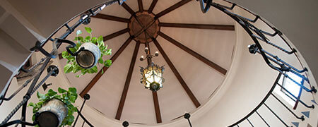 An image shot looking upward in the stairwell of the spiral staircase.