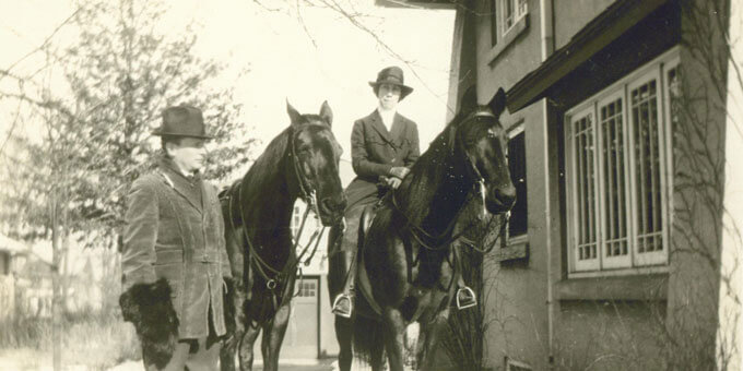 Davis stands beside his horse while Hazle sits atop hers.