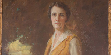Painted portrait of Lillian Brewer Buck, 80, wearing a period dress with a black pearl choker.