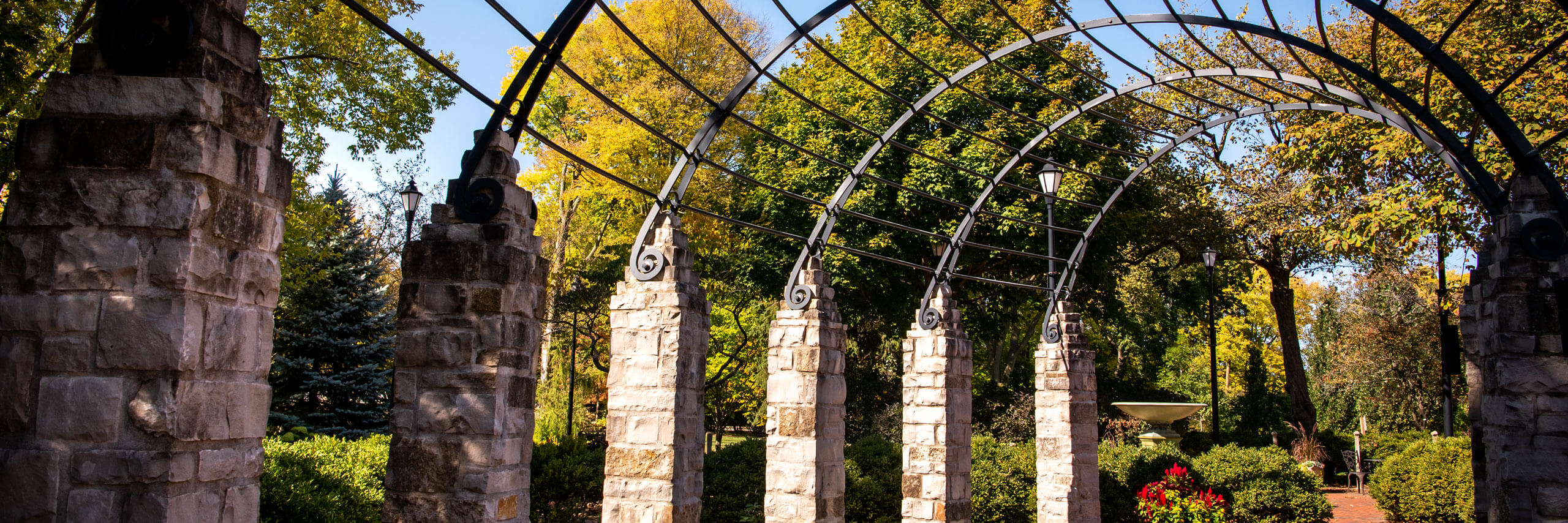 A metal frame arches over the walkways on the Ewing property.