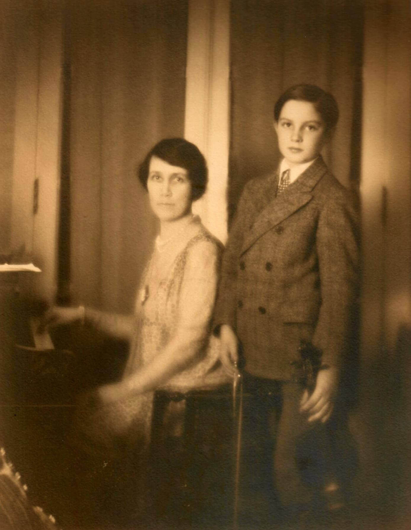 Hazle and Nelson Ewing sitting at the piano, Nelson holding his violin at 1522 E. Olive, Bloomington, IL circa 1925