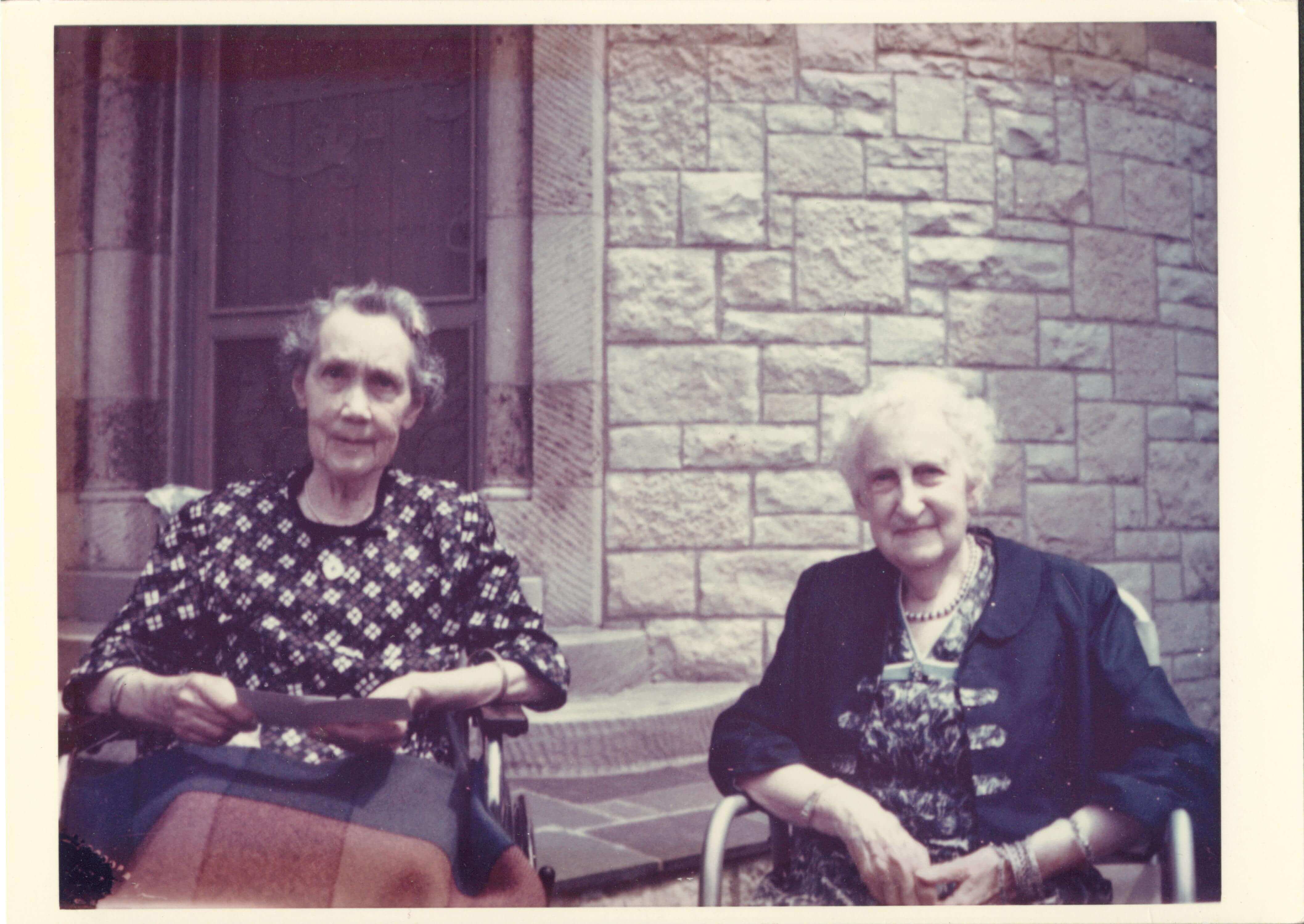 Hazle Buck Ewing and Julia Hodge sitting on the slate patio of Sunset Hill