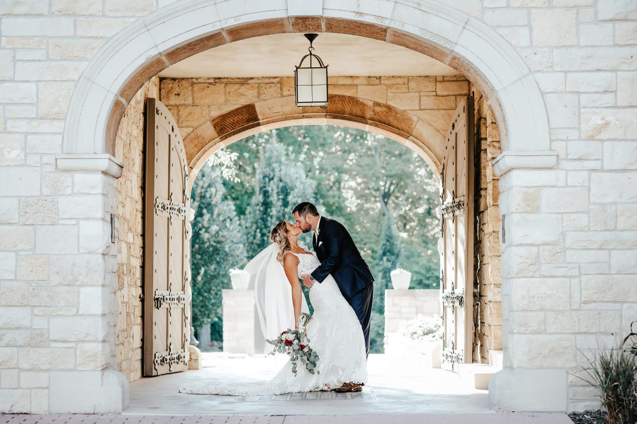 Bride and groom kissing leaving the altar.