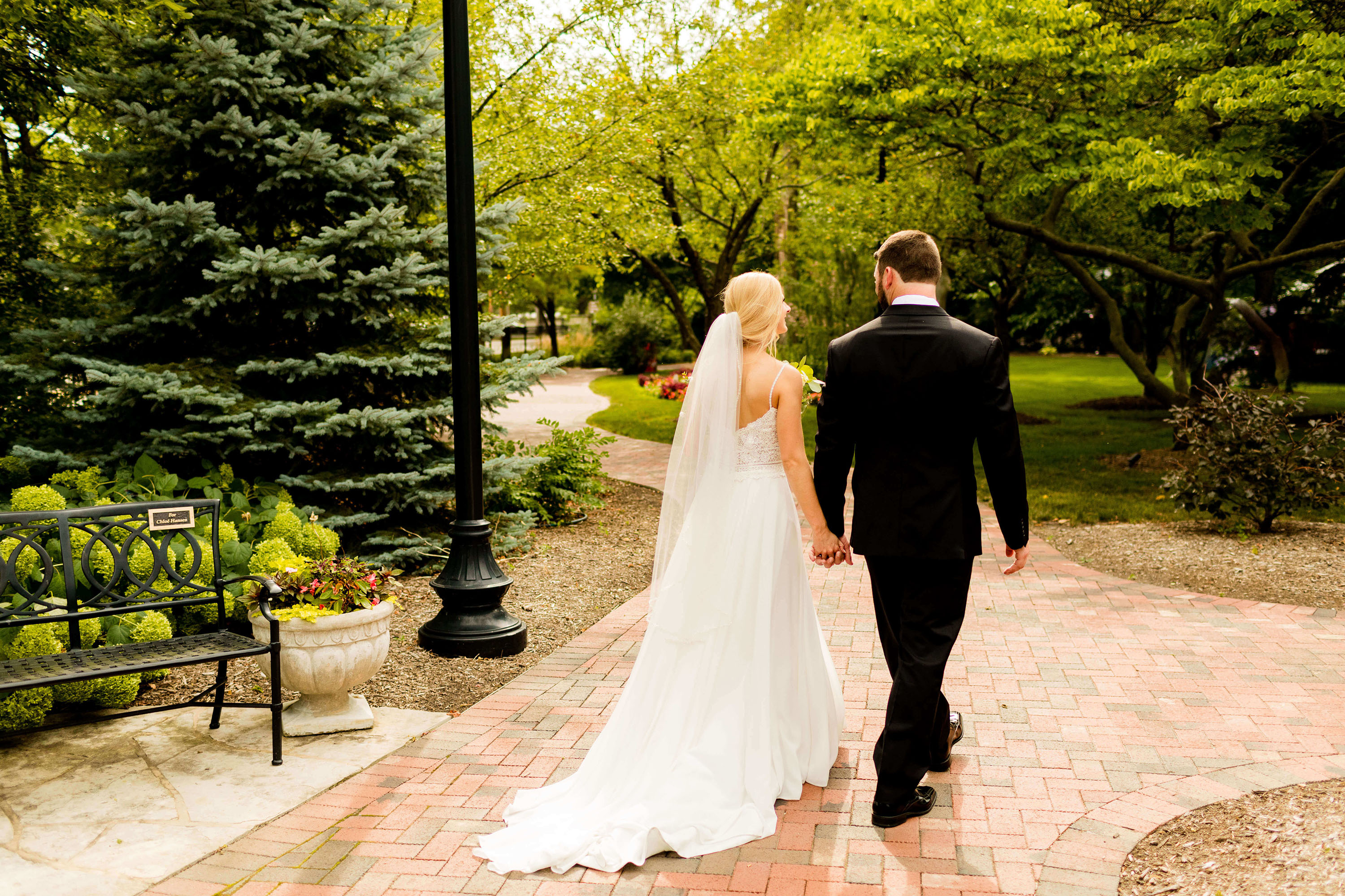 Bride and groom walking around the Ewing Manor.