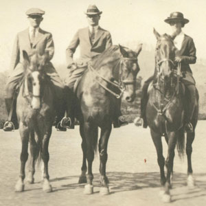 Hazle Buck Ewing, Davis Ewing, and Nelson Buck sit atop their horses.